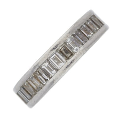 Lot 35 - A platinum calibre-cut diamond full eternity...
