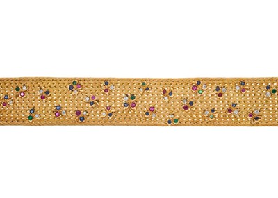 Lot 36 - An 18ct gold multi-gem shamrock bracelet, with...