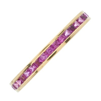 Lot 83 - An 18ct gold calibre-cut pink sapphire full...