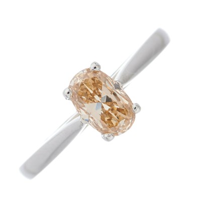 Lot 144 - A platinum brown diamond single-stone ring,...