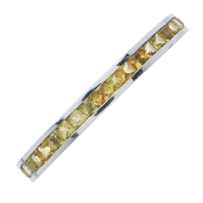 Lot 179 - An 18ct gold calibre-cut yellow sapphire full...