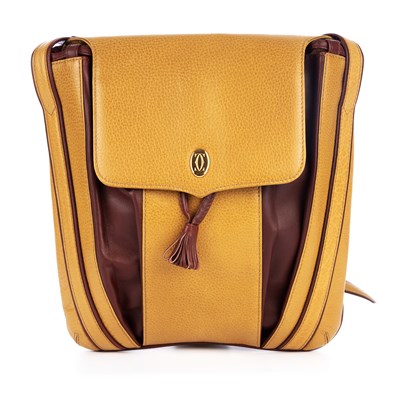 Lot 301 - Cartier, a Must De Cartier mustard drawstring...