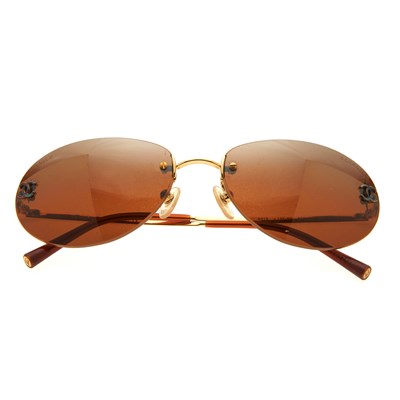 Lot 327 - Chanel, a pair of rimless sunglasses, designed...