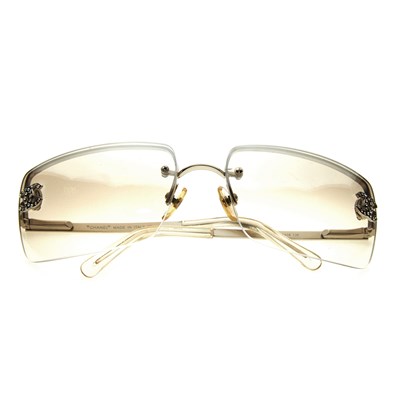 Lot 328 - Chanel, a pair of sunglasses, featuring clear...