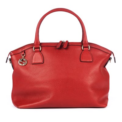 Lot 366 - Gucci, a red leather handbag, designed with a...