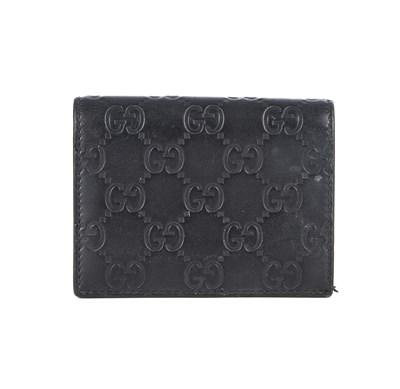 Lot 375 - Gucci, a black Guccissima bifold wallet,...