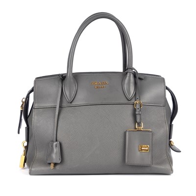 Lot 473 - Prada, a grey leather handbag, crafted from...