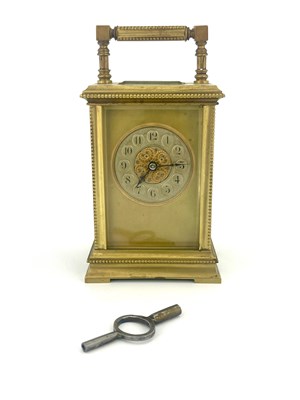 Lot 634 - A French gilt brass carriage timepiece,...