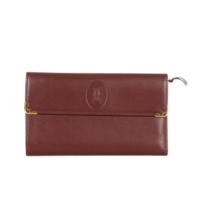 Lot 293 - Cartier, a Bordeaux leather wallet, crafted...