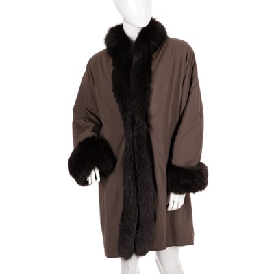 Lot 487 - Guy Laroche, a knee-length fur trimmed coat,...