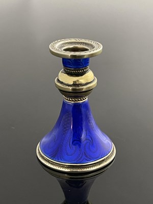 Lot 12 - A Continental silver gilt and blue enamel miniature candlestick