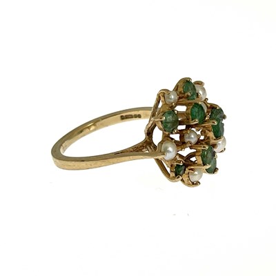 Lot 3 - A 9ct gold emerald and split pearl cluster ring