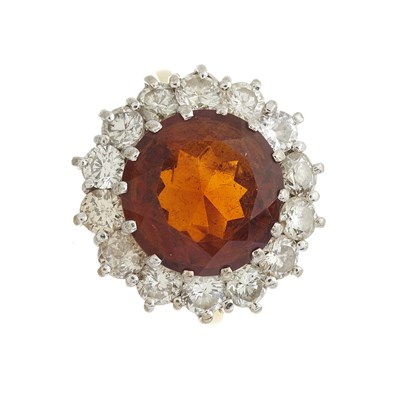 Lot 135 - An 18ct gold fire opal and diamond cluster ring