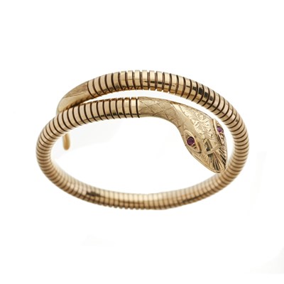 Lot 76 - A 9ct gold ruby snake bangle bracelet