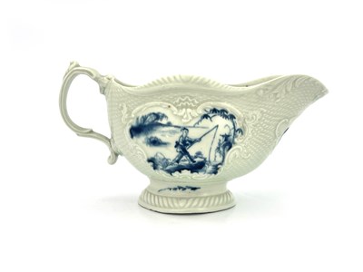 Lot 1029 - A Worcester blue and white relief moulded sauceboat