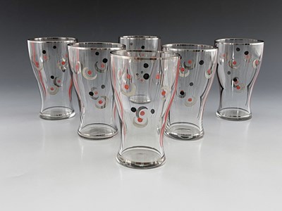 Lot 516 - A set of Art Deco enamel and lustre painted...