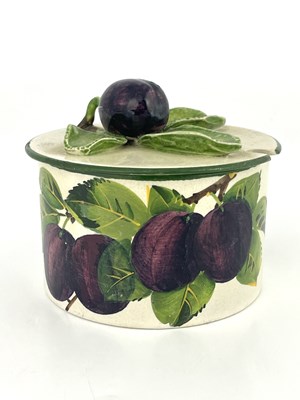 Lot 806 - Wemyss for Thomas Goode, a plum painted and relief moulded preserve jar and cover