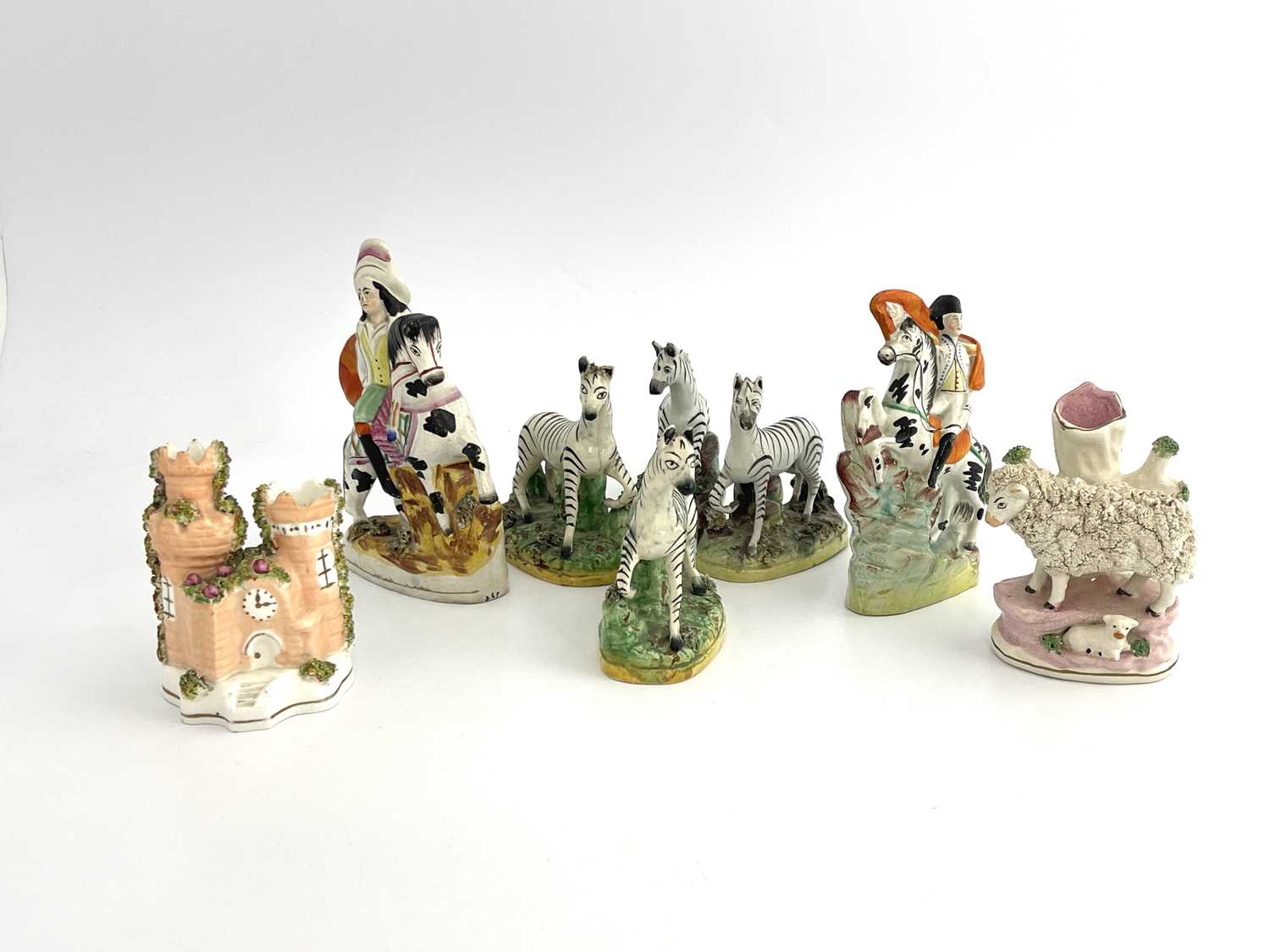 Lot 1034 - A collection of Staffordshire figures