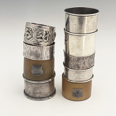 Lot 381 - A group of nine napkin rings, to include five...