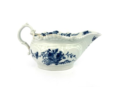 Lot 1009 - A Worcester blue and white relief moulded cream boat