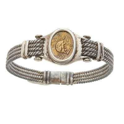 Lot 101 - A silver and 18ct gold Zodiac bangle bracelet