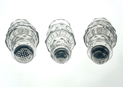 Lot 77 - Three silver mounted facet cut glass condiment shakers