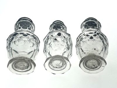 Lot 77 - Three silver mounted facet cut glass condiment shakers