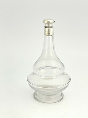 Lot 84 - A George V silver mounted glass decanter,...