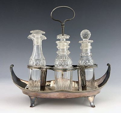 Lot 20 - A George III Old Sheffield Plate and cut glass four bottle cruet stand