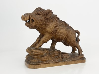 Lot 298 - A Black Forest carved wood figure of a boar,...
