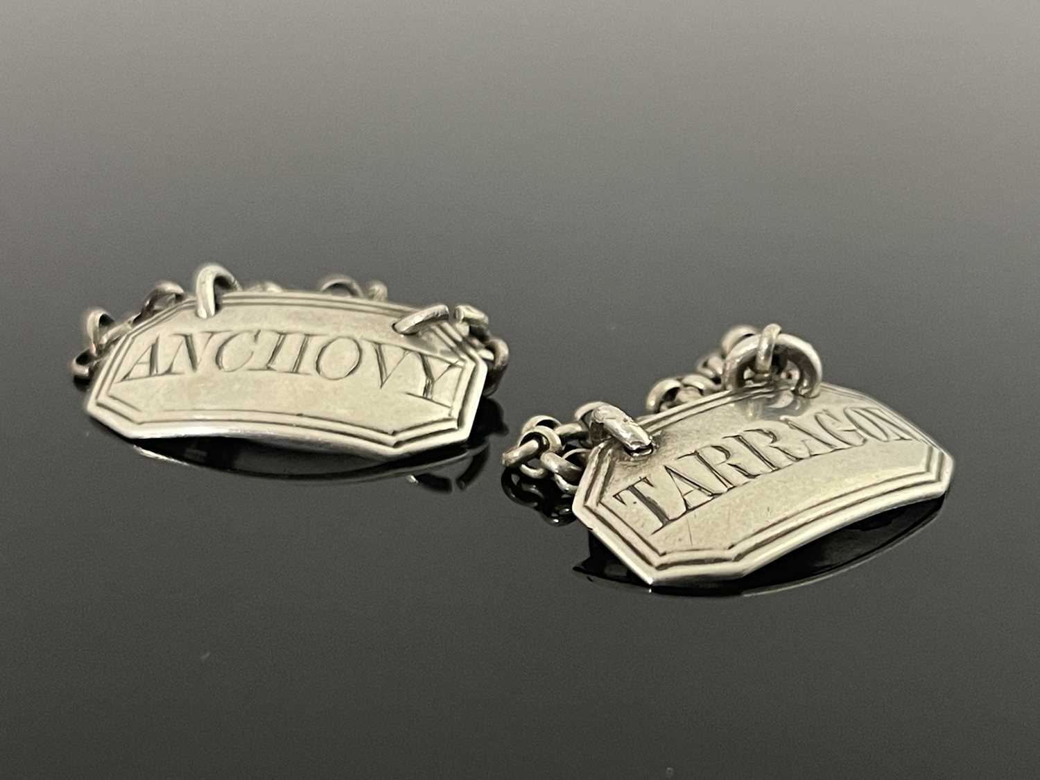 Lot 79 - A pair of George IV silver condiment labels for Anchovy and Tarragon