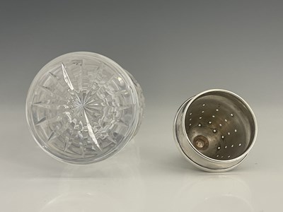 Lot 106 - A twentieth-century glass and silver topped...