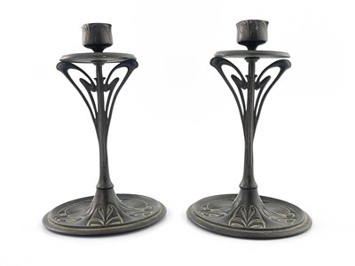Lot 135 - A pair of bronze Art Nouveau candlesticks,...