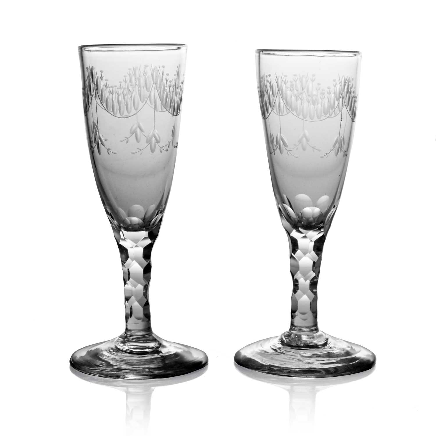 Lot 523 - A pair of 18th century glass Champagne flutes,...