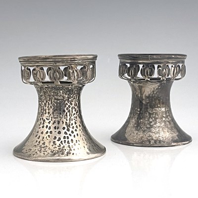 Lot 96 - A pair of Arts and Crafts silver pedestal salt...