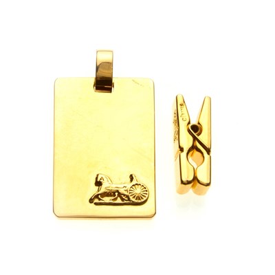 Lot 44 - Celine, a metal carriage plate pendant and peg...