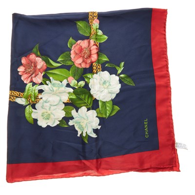 Lot 63 - Chanel, a silk scarf, featuring a gold chain...