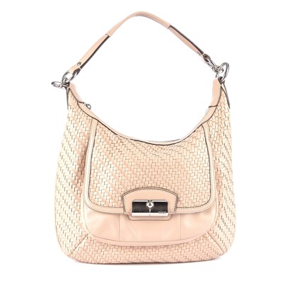 Lot 85 - Coach, a woven Kristen hobo handbag, crafted...