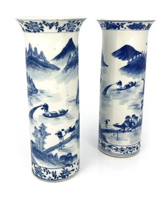 Lot 556 - A pair of Chinese blue and white sleeve vases