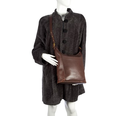 Lot 91 - Coach, a brown leather handbag and a Caroline...