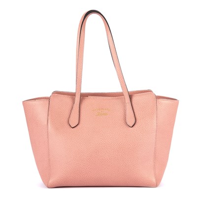 Lot 121 - Gucci, a Swing tote, crafted from pale pink...