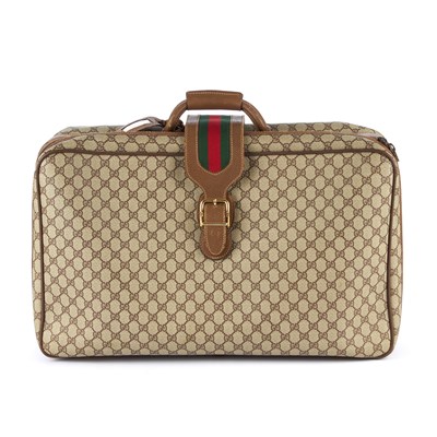 Lot 127 - Gucci, a Supreme Web suitcase, featuring maker'...