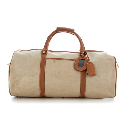 Lot 128 - Gucci, a canvas holdall travel bag, crafted...