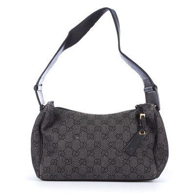 Lot 140 - Gucci, a black denim GG handbag, featuring a...