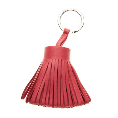 Lot 173 - Hermes, a pink leather tassel bag charm, full...