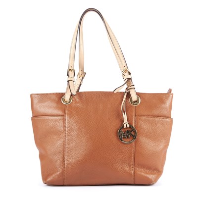 Lot 265 - Michael Kors, a tan leather Jet Set Top Zip...