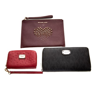 Lot 271 - Michael Kors, a Heart Studded wristlet clutch...