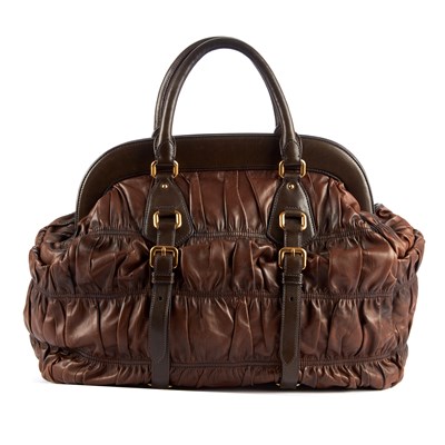 Lot 302 - Prada, a brown Gaufre handbag, featuring a...