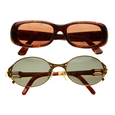 Lot 358 - Two pairs of designer sunglasses, to include a...