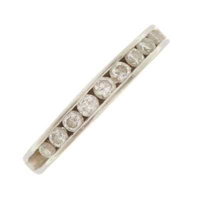 Lot 389 - A platinum brilliant-cut diamond half eternity...
